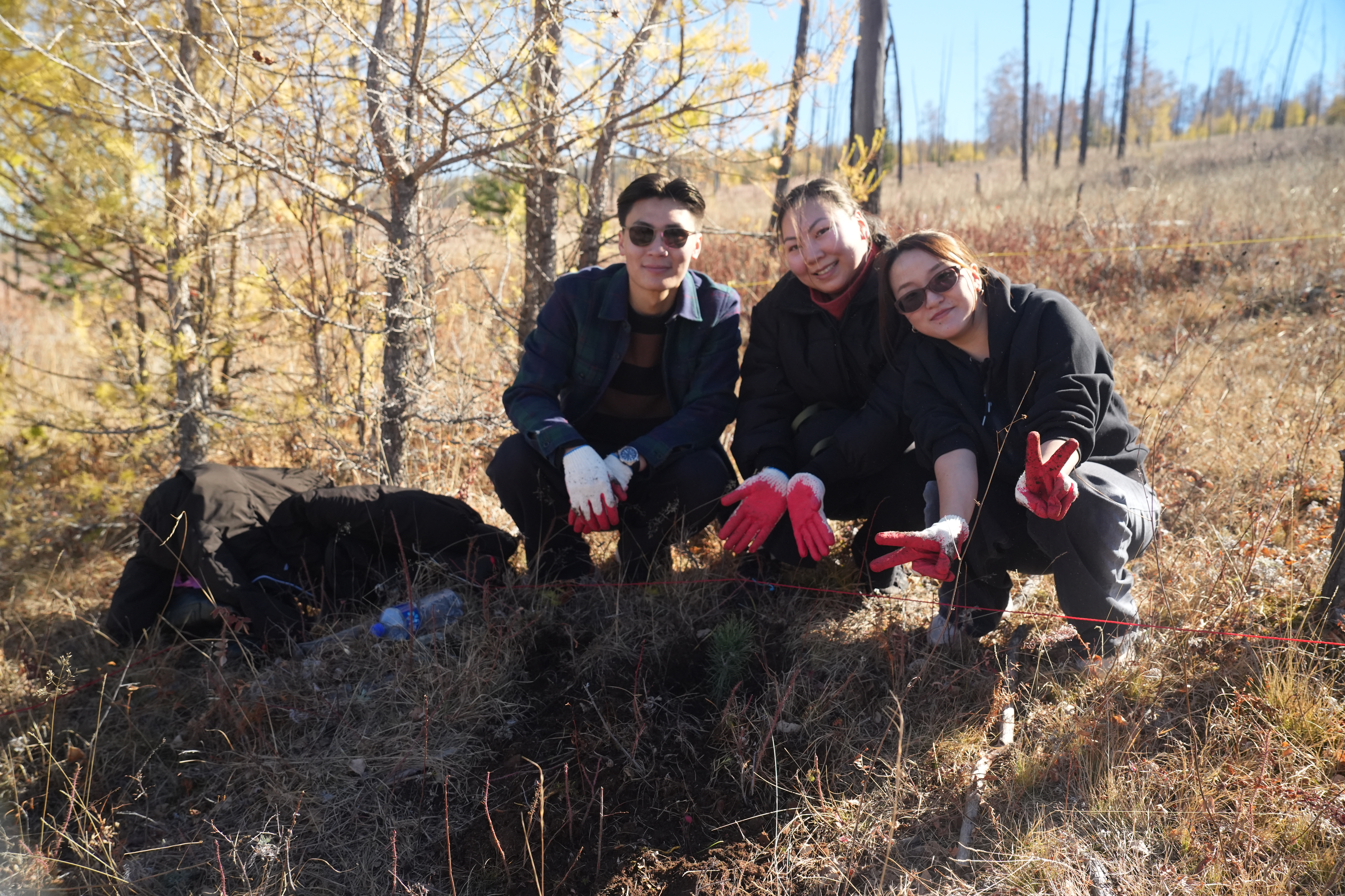 PINE+ volunteers after planting